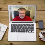 Video Counsellor Dean Richardson on a Macbook Air