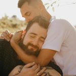Two men hugging