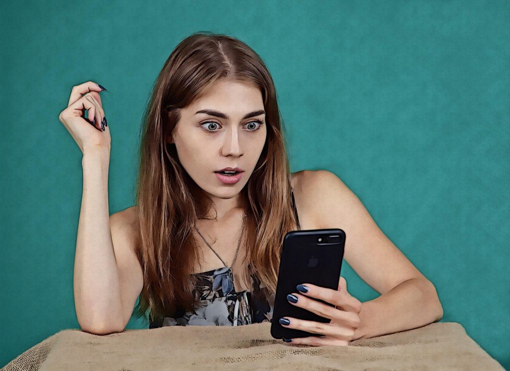 Girl Receiving Shocking News on Phone